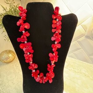 Red coral necklace with crystal accents.